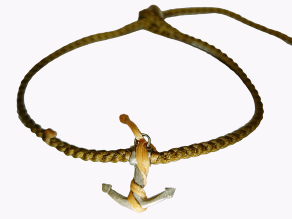 thick cord bracelet/anklet on khaki with ⚓ and yellow beige catching.