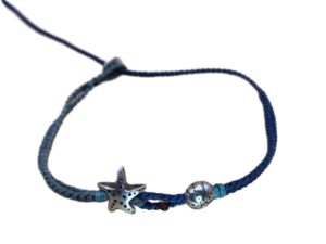 1737481877426_pixian_ai double thin cord bracelet/anklet on gray blue and dark denim with starfish and sea urchin.