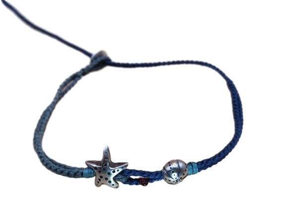 double thin cord bracelet/anklet on gray blue and dark denim with starfish and sea urchin.