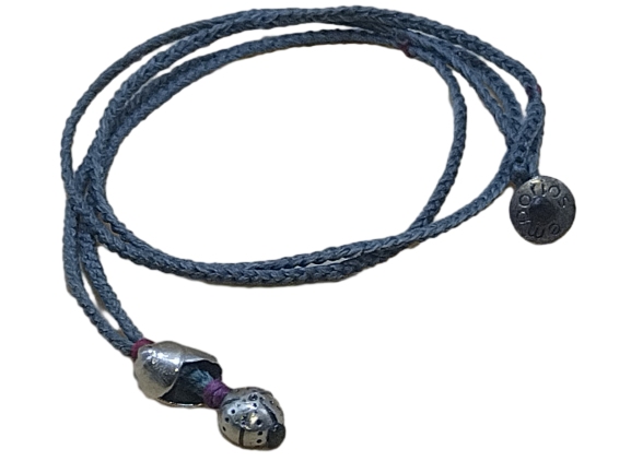 thin cord necklace (multi jewelry) on gray blue with 🐚 and sea urchin.