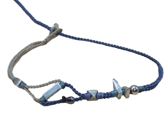 double thin cord bracelet/anklet on beige and denim with seven geometric beads.