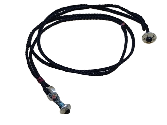 thin cord necklace (multi jewelry) on black with two geometric beads.
