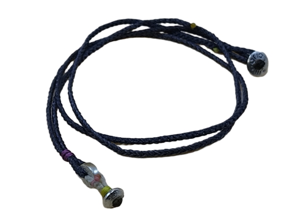 thin cord necklace (multi jewelry) on coal with two geometric beads.