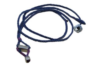 thin cord necklace (multi jewelry) on denim with two geometric beads.