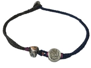 double thin & thick cord bracelet/anklet on khaki and dark denim with rock & "terra".
